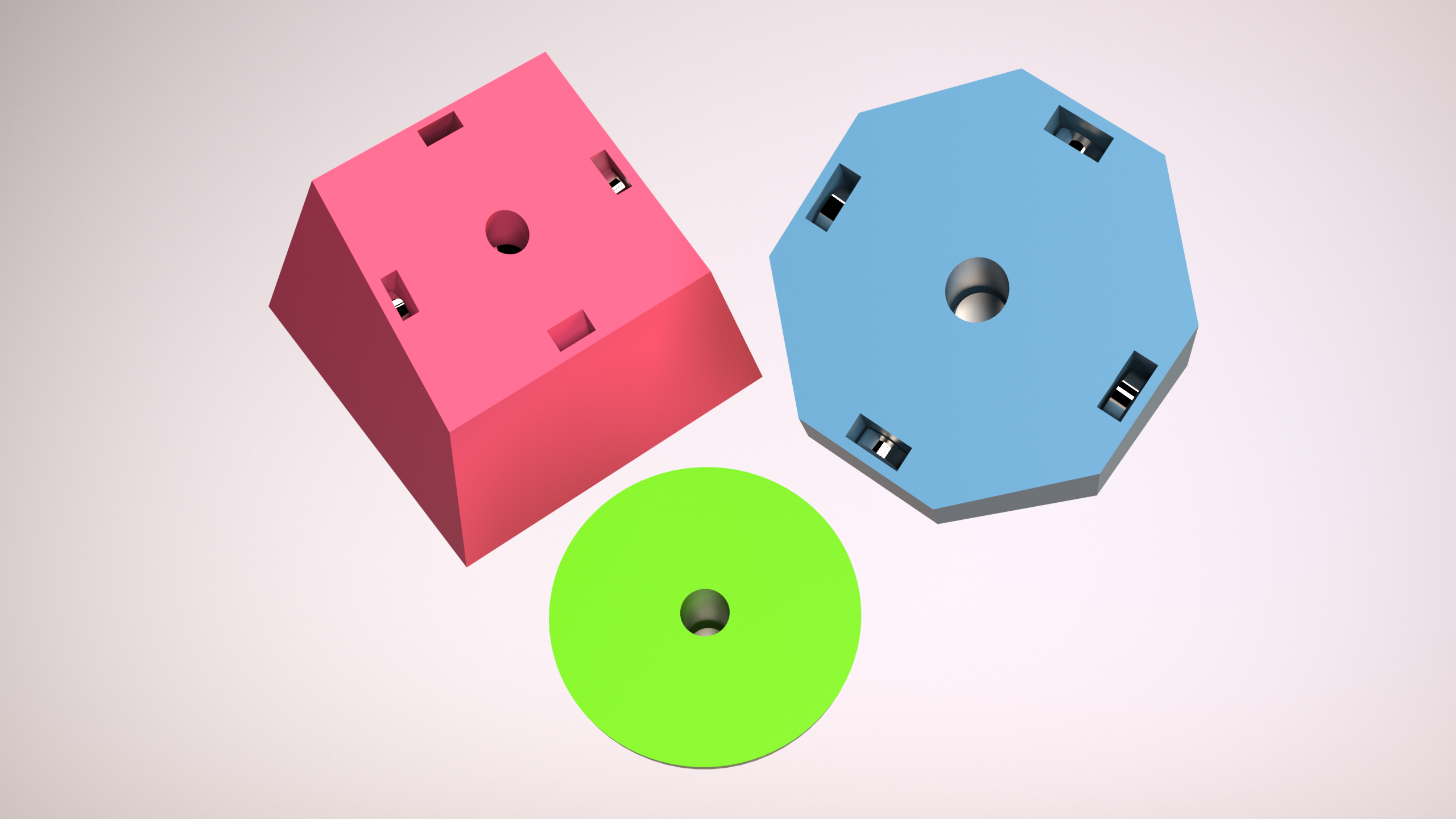 Exploded view of pink, blue, and green pieces showing internal magnet cavities